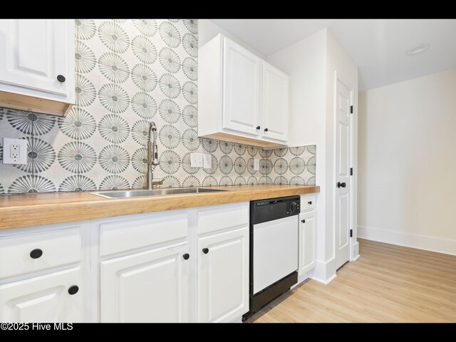 711 Glenarthur Dr, Wilmington, NC 28412 - kitchen featuring dishwasher, butcher block counters, a sink, tasteful backsplash, and light wood-style floors
