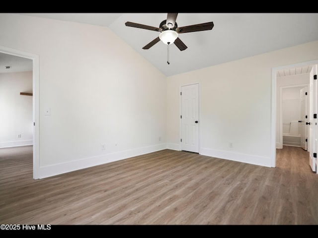 711 Glenarthur Dr, Wilmington, NC 28412 - empty room with lofted ceiling, light wood-type flooring, ceiling fan, and baseboards