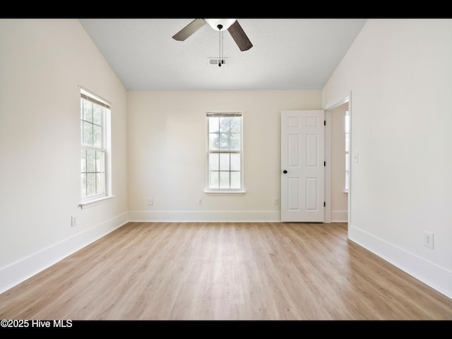711 Glenarthur Dr, Wilmington, NC 28412 - unfurnished room featuring light wood-type flooring, ceiling fan, baseboards, and lofted ceiling