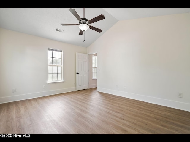 711 Glenarthur Dr, Wilmington, NC 28412 - spare room featuring wood finished floors, ceiling fan, baseboards, and high vaulted ceiling