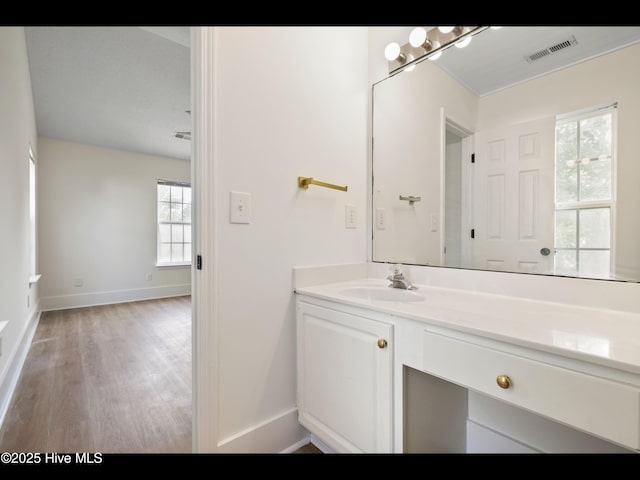 711 Glenarthur Dr, Wilmington, NC 28412 - bathroom with wood finished floors, vanity, and baseboards