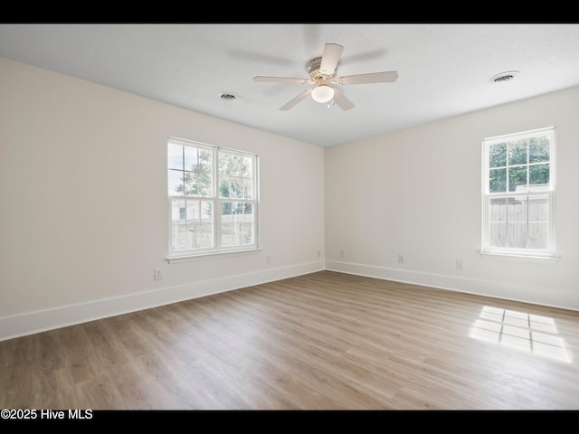 711 Glenarthur Dr, Wilmington, NC 28412 - unfurnished room featuring light wood finished floors, ceiling fan, and baseboards