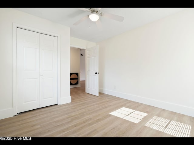 711 Glenarthur Dr, Wilmington, NC 28412 - unfurnished bedroom with light wood-type flooring, a closet, baseboards, and a ceiling fan