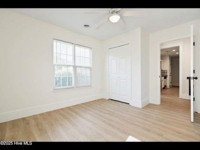 711 Glenarthur Dr, Wilmington, NC 28412 - unfurnished bedroom with light wood-style floors, baseboards, and a closet