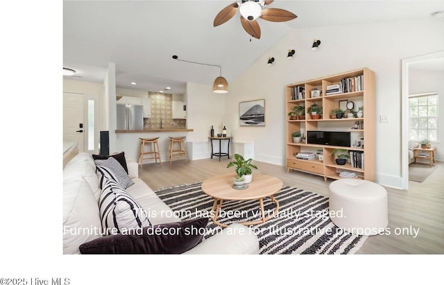 711 Glenarthur Dr, Wilmington, NC 28412 - living area with light wood-style floors, a ceiling fan, vaulted ceiling, and baseboards