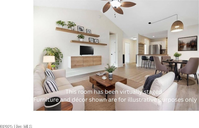 711 Glenarthur Dr, Wilmington, NC 28412 - living room with wood finished floors, ceiling fan, lofted ceiling, and baseboards
