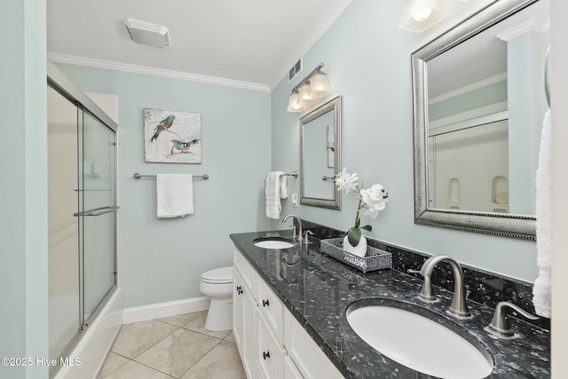 bathroom featuring an enclosed shower, ornamental molding, toilet, and a sink
