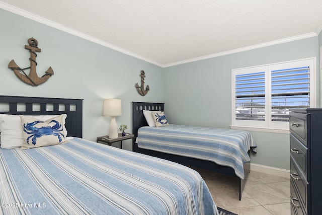 bedroom with ornamental molding, a textured ceiling, baseboards, and light tile patterned floors