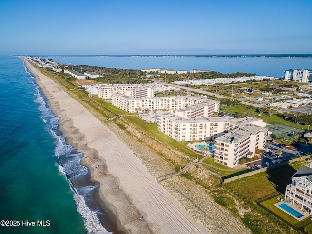 aerial view featuring a view of the beach and a water view