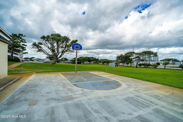 view of basketball court featuring a yard and community basketball court
