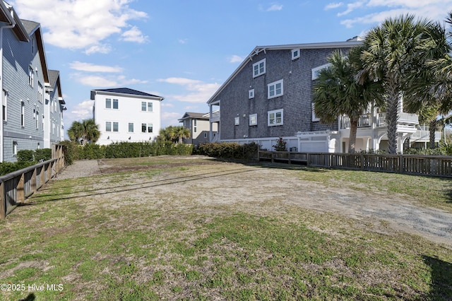 view of yard with fence and a residential view