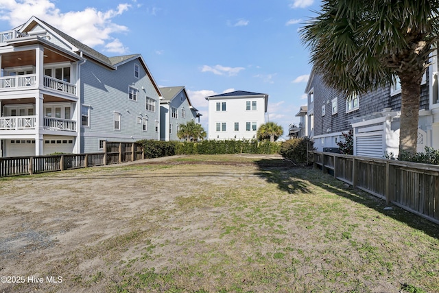 view of yard with fence and a residential view