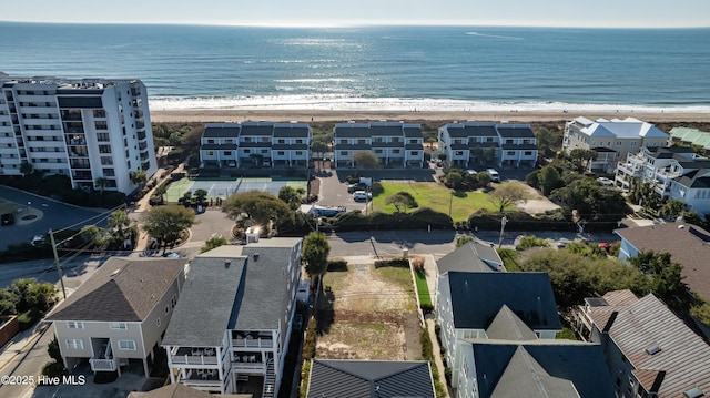 aerial view featuring a beach view, a water view, and a residential view