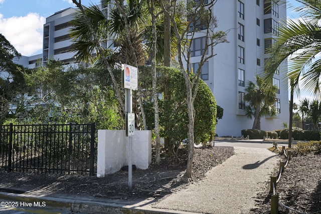 view of property's community featuring fence
