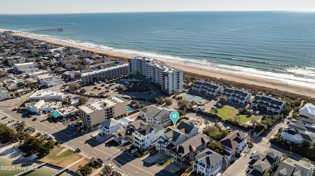 aerial view with a view of the beach and a water view
