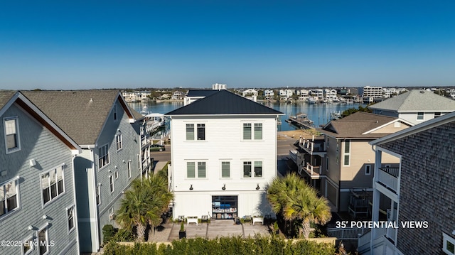 exterior space with a water view
