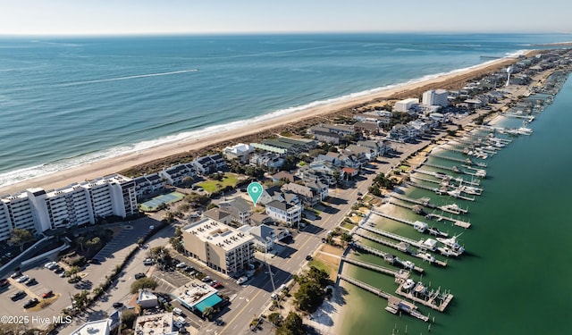 aerial view featuring a water view and a view of the beach