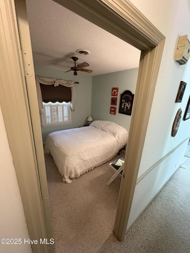 16 Bayberry Cir, Calabash, NC 28467 - bedroom featuring carpet, a textured ceiling, and ceiling fan
