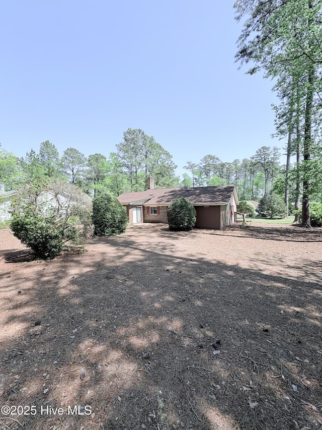 16 Bayberry Cir, Calabash, NC 28467 - back of house with a chimney