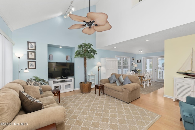 104 Island Quay Ct, Atlantic Beach, NC 28512 - living area with light wood-style floors, a ceiling fan, high vaulted ceiling, track lighting, and baseboards