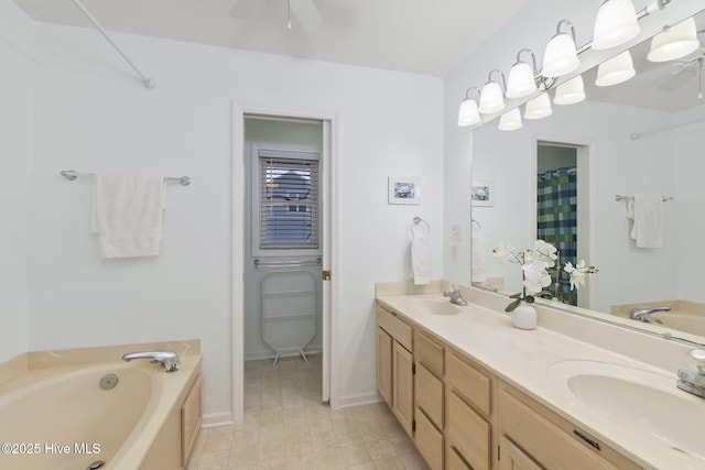 104 Island Quay Ct, Atlantic Beach, NC 28512 - bathroom with ceiling fan, a garden tub, double vanity, and baseboards