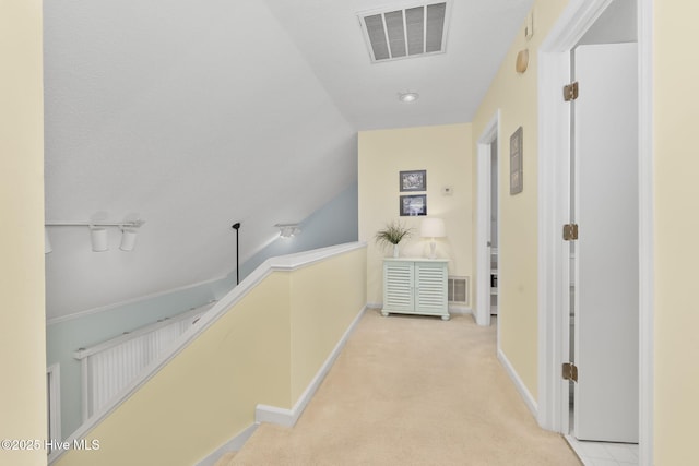 104 Island Quay Ct, Atlantic Beach, NC 28512 - corridor featuring an upstairs landing, light carpet, and baseboards