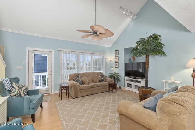 104 Island Quay Ct, Atlantic Beach, NC 28512 - living room with ceiling fan, track lighting, baseboards, light wood-type flooring, and high vaulted ceiling