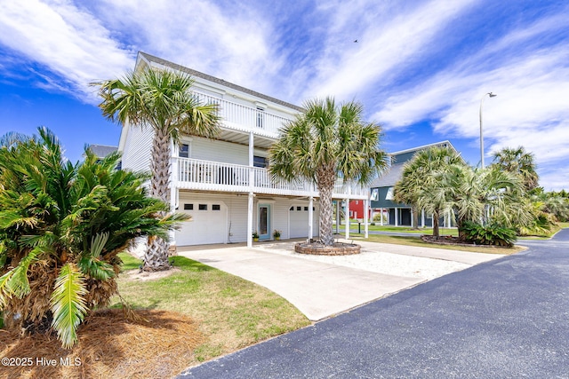 104 Island Quay Ct, Atlantic Beach, NC 28512 - coastal home with a garage, driveway, and a balcony