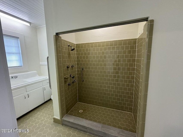 bathroom featuring a stall shower and tile patterned flooring