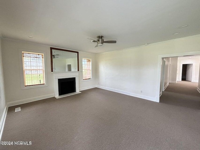 unfurnished living room featuring dark colored carpet, a fireplace, a ceiling fan, and baseboards
