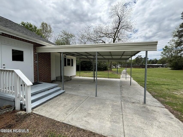 view of vehicle parking featuring driveway and a carport