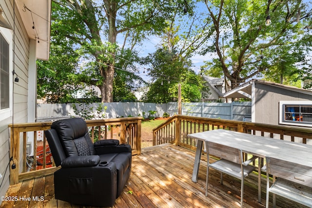 wooden deck featuring a fenced backyard