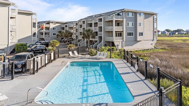 community pool featuring fence