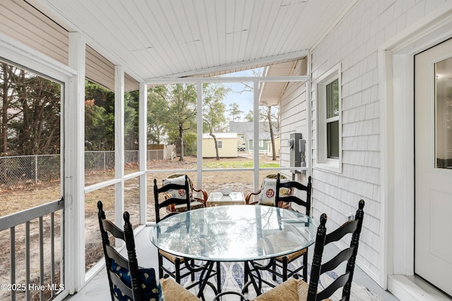 sunroom / solarium with outdoor dining space