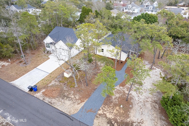 birds eye view of property with a residential view