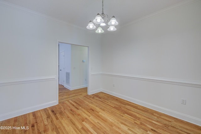 1708 N County Dr, Castle Hayne, NC 28429 - empty room with a chandelier, light wood-type flooring, ornamental molding, and baseboards