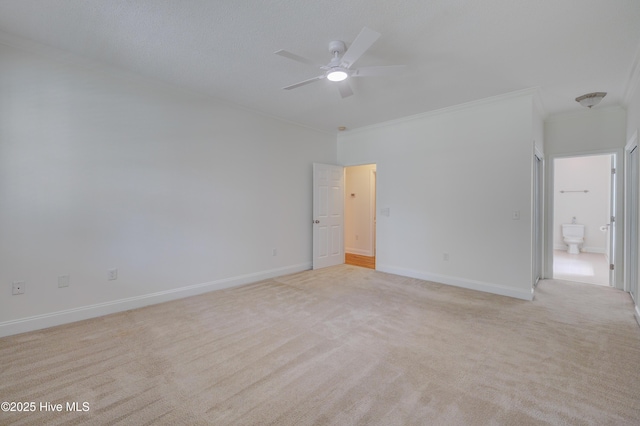 1708 N County Dr, Castle Hayne, NC 28429 - spare room featuring ornamental molding, light carpet, a ceiling fan, and baseboards