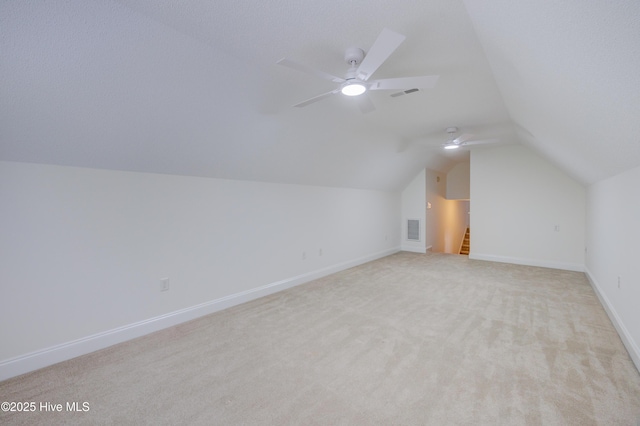 1708 N County Dr, Castle Hayne, NC 28429 - bonus room featuring vaulted ceiling, light colored carpet, a ceiling fan, and baseboards