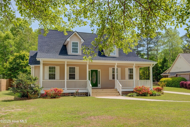 1708 N County Dr, Castle Hayne, NC 28429 - new england style home featuring covered porch, a shingled roof, and a front lawn
