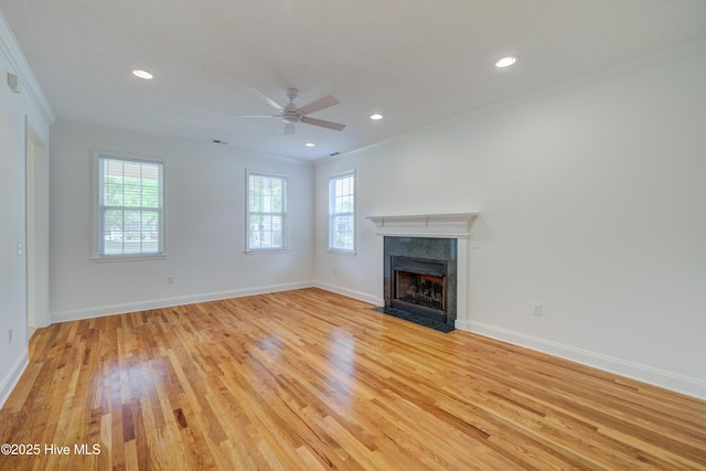 1708 N County Dr, Castle Hayne, NC 28429 - unfurnished living room with ornamental molding, light wood finished floors, baseboards, a fireplace, and ceiling fan