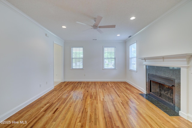 1708 N County Dr, Castle Hayne, NC 28429 - unfurnished living room featuring ornamental molding, a tile fireplace, ceiling fan, light wood-style floors, and recessed lighting