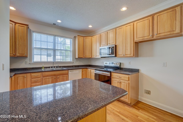 1708 N County Dr, Castle Hayne, NC 28429 - kitchen with appliances with stainless steel finishes, a sink, light wood-type flooring, ornamental molding, and baseboards