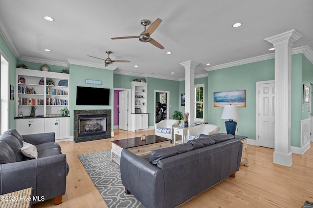 449 Maritime Pl, Pine Knoll Shores, NC 28512 - living room with ornate columns, ceiling fan, a fireplace, recessed lighting, and light wood finished floors