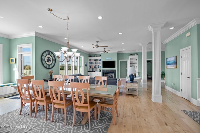 449 Maritime Pl, Pine Knoll Shores, NC 28512 - dining area featuring ornate columns, recessed lighting, a fireplace, a ceiling fan, and light wood finished floors