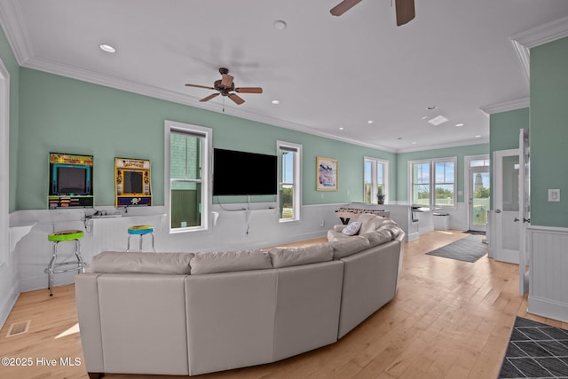 449 Maritime Pl, Pine Knoll Shores, NC 28512 - living room with a ceiling fan, wainscoting, crown molding, wood finished floors, and recessed lighting