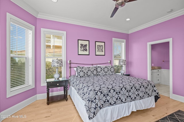 449 Maritime Pl, Pine Knoll Shores, NC 28512 - bedroom featuring crown molding, light wood-style floors, baseboards, ceiling fan, and ensuite bath