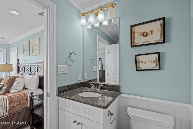 449 Maritime Pl, Pine Knoll Shores, NC 28512 - ensuite bathroom featuring toilet, ornamental molding, wainscoting, and vanity