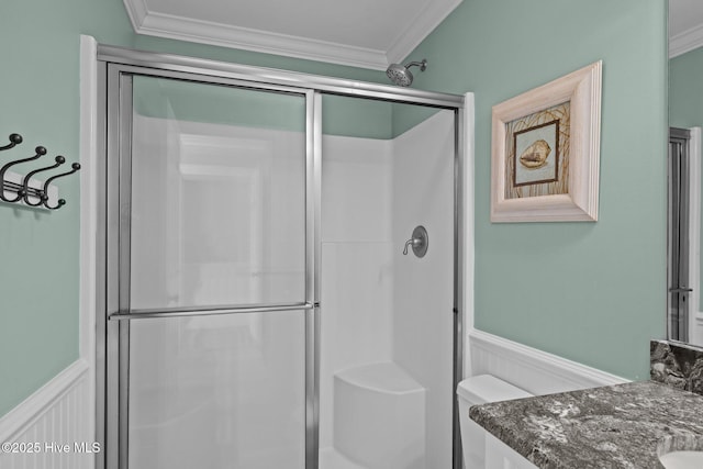 449 Maritime Pl, Pine Knoll Shores, NC 28512 - full bathroom featuring crown molding, a stall shower, vanity, and a wainscoted wall