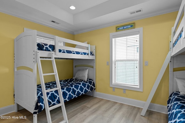 449 Maritime Pl, Pine Knoll Shores, NC 28512 - bedroom with wood finished floors, baseboards, and crown molding