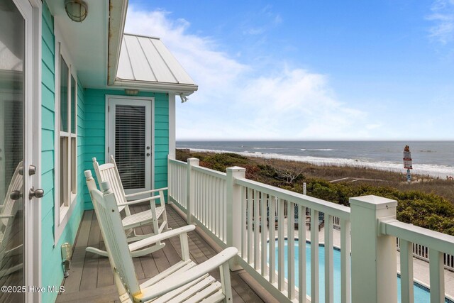 449 Maritime Pl, Pine Knoll Shores, NC 28512 - balcony featuring view of water and beach